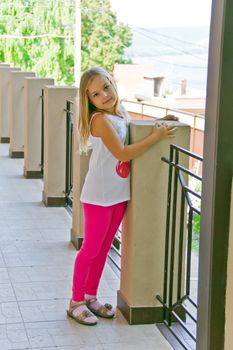 Cute girl with blond long hair and blue eyes