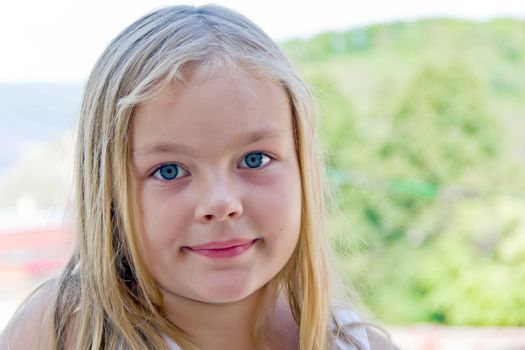 Photo of cute girl with big blue eyes
