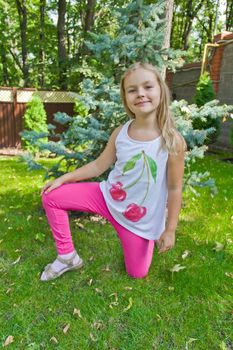 Cute girl with blond long hair in summer