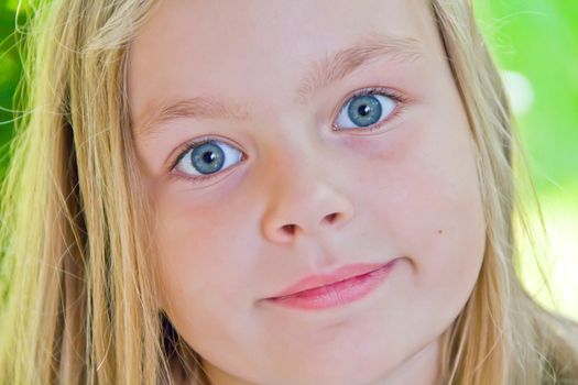 Photo of cute girl with big blue eyes