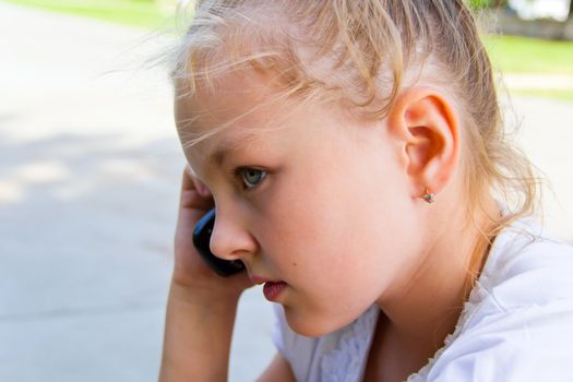 Photo of cute girl talking by cellular