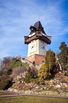 Graz, Austria - January 16, 2011: Tourists visiting Uhrturm old clock tower in Graz, Styria, Austria