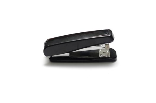 black stapler on a white background