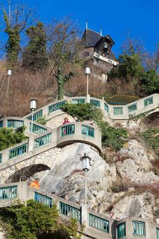 Tourists visiting Schlossberg (Castle Hill), mountain in Graz, part of the UNESCO World heritage in Graz, Austria