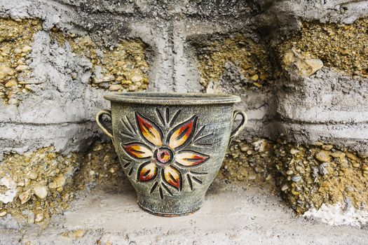 Old ceramic vase painted with a flower picture