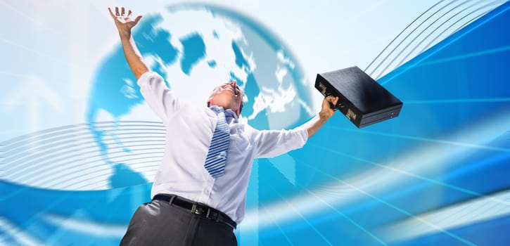 Businessman holding briefcase and cheering against global business graphic in blue