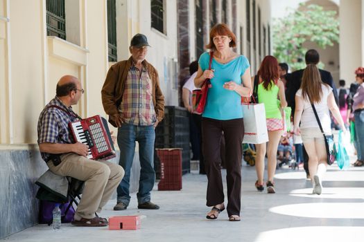 THESSALONIKI, GREECE - JUNE 28: The number of street musicians in the city has increased dramatically. The economic crisis has hit the elderly on June 28, 2011 in Thessaloniki, Greece