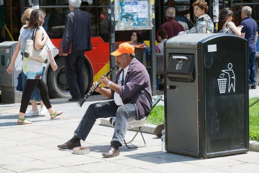 THESSALONIKI, GREECE - JUNE 28: The number of street musicians in the city has increased dramatically. The economic crisis has hit the elderly on June 28, 2011 in Thessaloniki, Greece