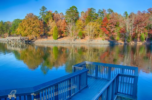 Autumn Landscape. Park in Autumn. The bright colors of autumn in the park by the lake.