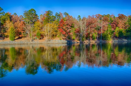 Autumn Landscape. Park in Autumn. The bright colors of autumn in the park by the lake.