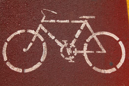 Bike lane. Sign for bicycle painted on the asphalt.