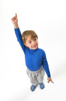 isolated little boy pointing upwards 