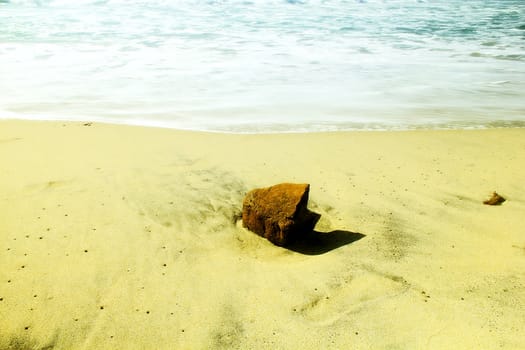 Red rock on the beach.