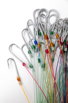 A fishing hooks tied with fishing line, isolated against a white background