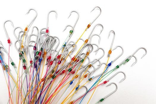 A fishing hooks tied with fishing line, isolated against a white background