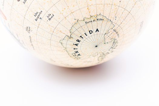 Part of a globe with map of South Pole isolated on white background