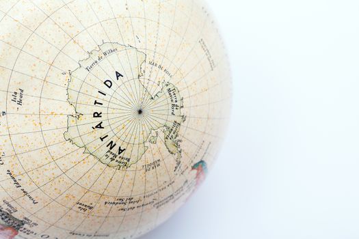 Part of a globe with map of South Pole isolated on white background