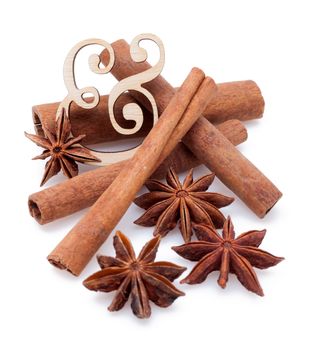 Star anise with cinnamon sticks isolated on white