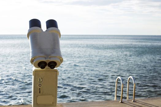 A telescope is ready for use, to observe the ocean.