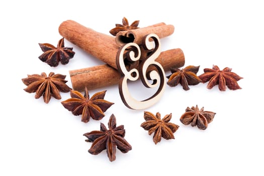 Star anise with cinnamon sticks isolated on white