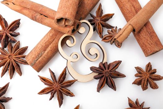 Star anise with cinnamon sticks isolated on white