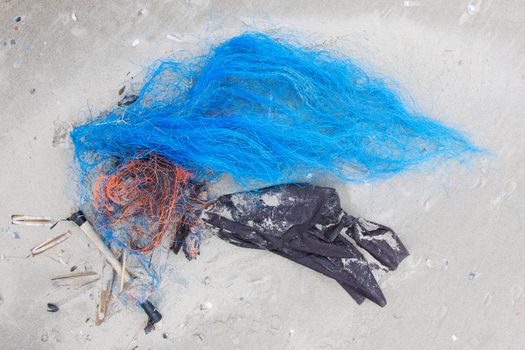 Rubble on a dutch beach, plastic and wood