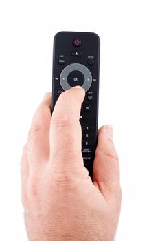 Hand holding TV remote control on white background