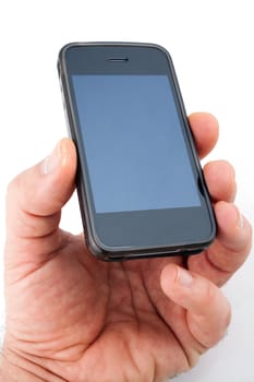 Male hand holding a smart phone mobile communicator over a white background.