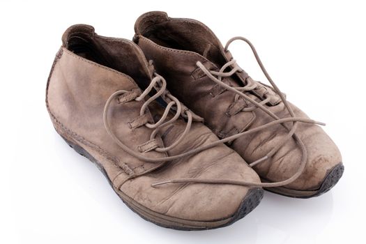 Pair of old leather boots isolated on the white background