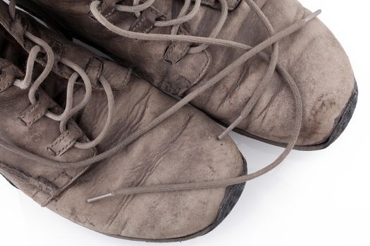 Pair of old leather boots isolated on the white background