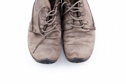 Pair of old leather boots isolated on the white background