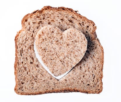 Piece of bread toast cut hole in shape of heart Isolated on white background