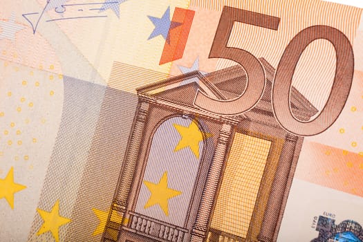 Detail of 50 euro banknotes on white background