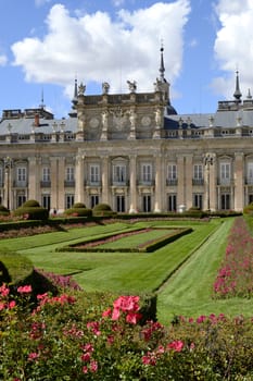 Palace, garden and flowers in foreground. La Granja de San Ildefonso, Segovia, Spain