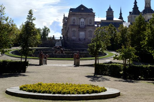 Palace, garden and flowers in foreground. La Granja de San Ildefonso, Segovia, Spain