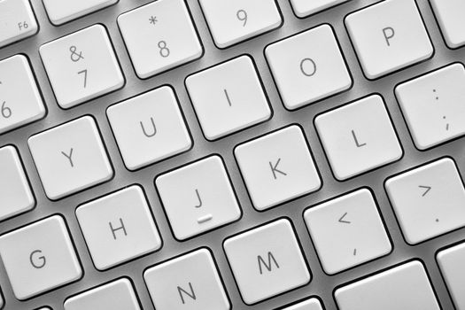 Keyboard of a notebook computer. White and silver.