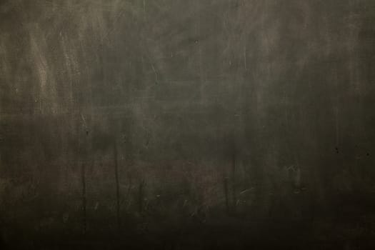 Blackboard / chalkboard texture. Empty blank black chalkboard with chalk traces