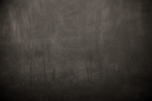 Blackboard / chalkboard texture. Empty blank black chalkboard with chalk traces