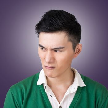 Funny facial expression, closeup Asian young man.