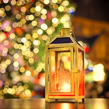 Lamp at european Christmas market in front of Christmas tree