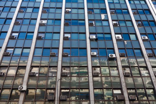 Old building with air condition units hang out.