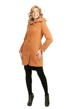 The girl in a yellow autumn coat on a white background