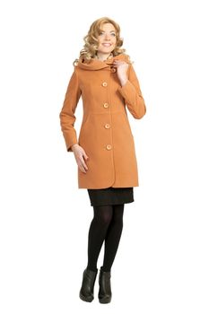 The girl in a yellow autumn coat on a white background