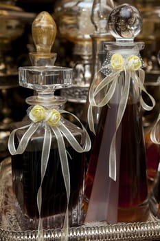 Decorated wedding bottles of homemade drink (cognac or brandy)