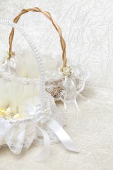 Elegant Wedding Favors decorated with artificial flowers in basket