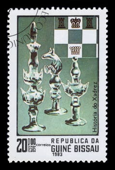 Guinea-Bissau, Republic - CIRCA 1983: A stamp printed by Guinea-Bissau, shows the chess pieces, series History of Chess, circa 1983