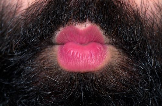 Kiss from a man with a beard who wearing lipstick