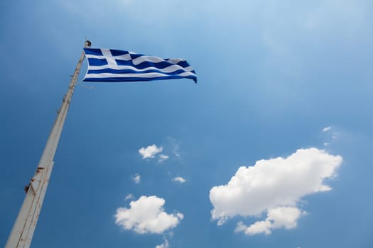 National flag of Greece waving over blue sky