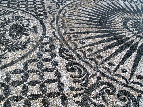 The mosaics with black and white pebbles, which we find to adorn the gardens and interiors of buildings and churches in the Greek islands. Chios island - Greece