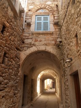Alley in Mesta village of Chios island in Greece; the village is very old from medieval age and houses were built very close to each other